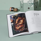 Aufgeschlagenes Best of Kochbuch vor Best of Adventskalender