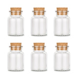 Sechs leere Korkengläser von Ankerkraut auf weißem Hintergrund.