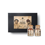 Bud Spencer und Terence Hill Geschenk-Box aus schwarzem Karton mit drei Korkengläsern davor.
