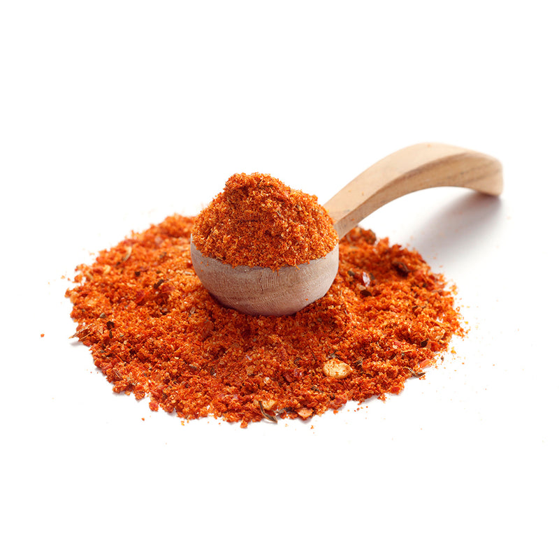 Harissa Gewürz von Ankerkraut als Häufchen auf einem Gewürzlöffel.