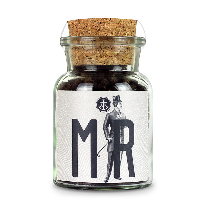 Ankerkraut Mr Pepper im Korkenglas auf weißem Hintergrund.