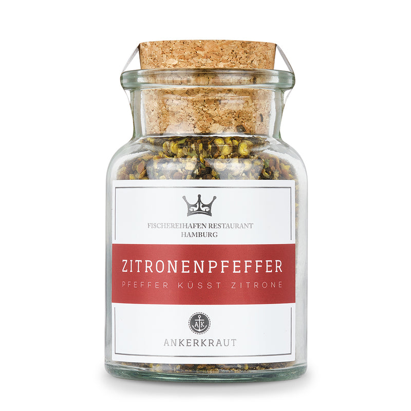 Zitronenpfeffer Mischung von Ankerkraut im Korkenglas auf weißem Hintergrund.